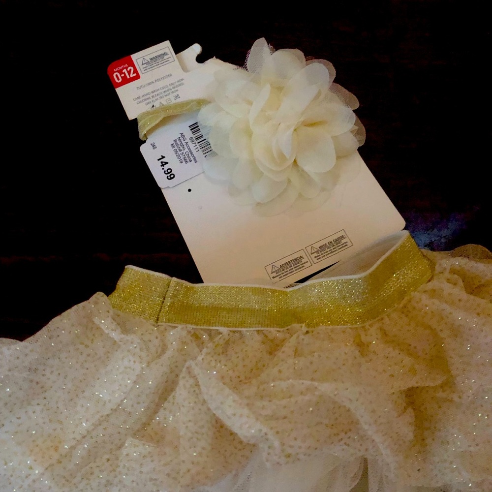 Rising star 0-12 M sparkling skirt with matching headband never worn.